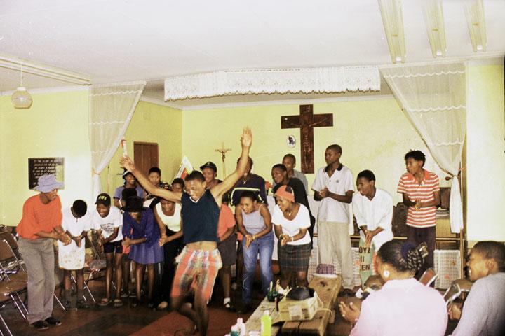 group of people worshipping in South African churches