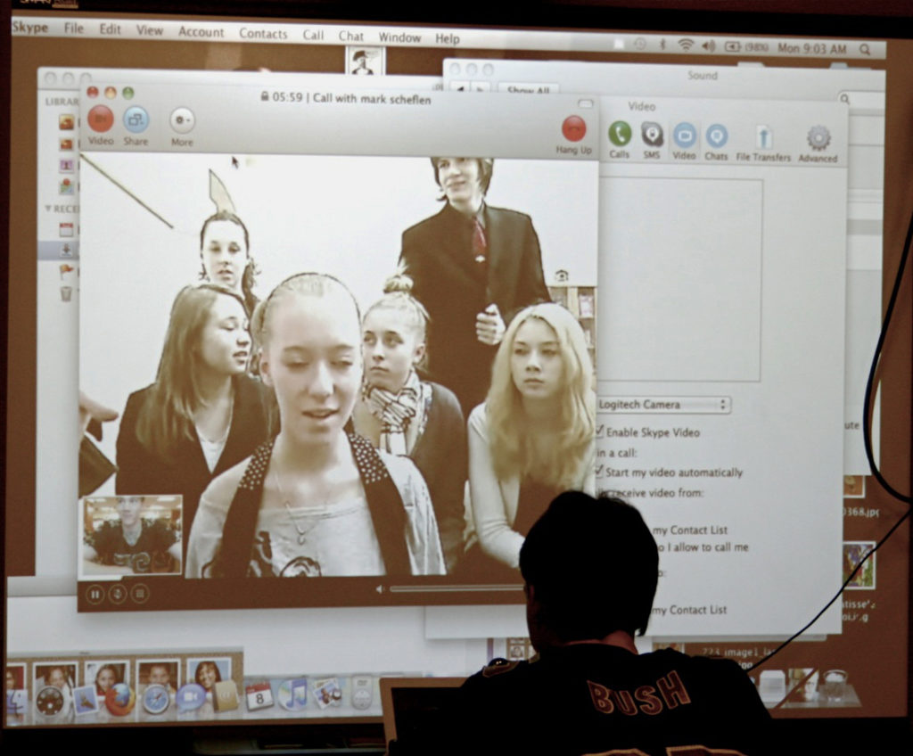 photo of students on a webconference in a classroom